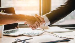 Close up handshake of business people in meeting attendance