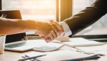 Close up handshake of business people in meeting attendance