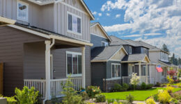 Tract homes with American Flag in new subdivision in North America suburb USA