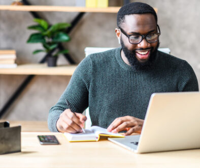 An African-American guy using laptop in the office