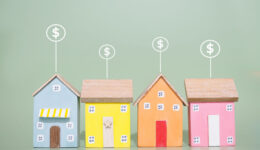 Miniature house and Dollar coin icons. The concept of price of house, Property investment, House mortgage, Real estate