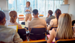 Senior business woman holding presentation
