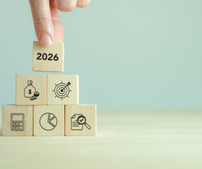 2026 financial, budget planning and management concept. Wooden blocks displaying the year 2026, a financial icons, symbolizing financial, budget planning, saving money, investment, economic growth.
