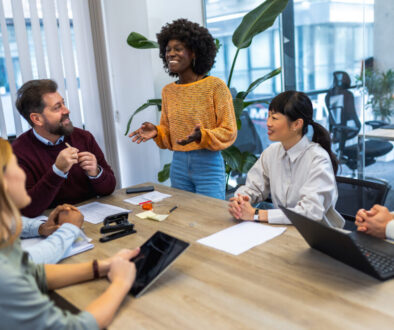 International workers group and team leader having teamwork discussion managing project at work in meeting room.